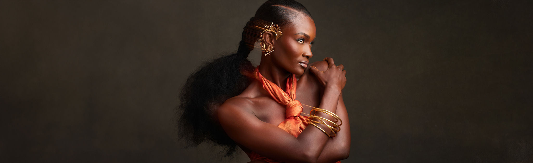 Coming Soon page featuring a mesmerizing swirl design, the KIMI (kimmy) brooch adds an eye-catching touch of sophistication and flair to your look. She pairs perfectly with the SZAN ring and NUSA earring.