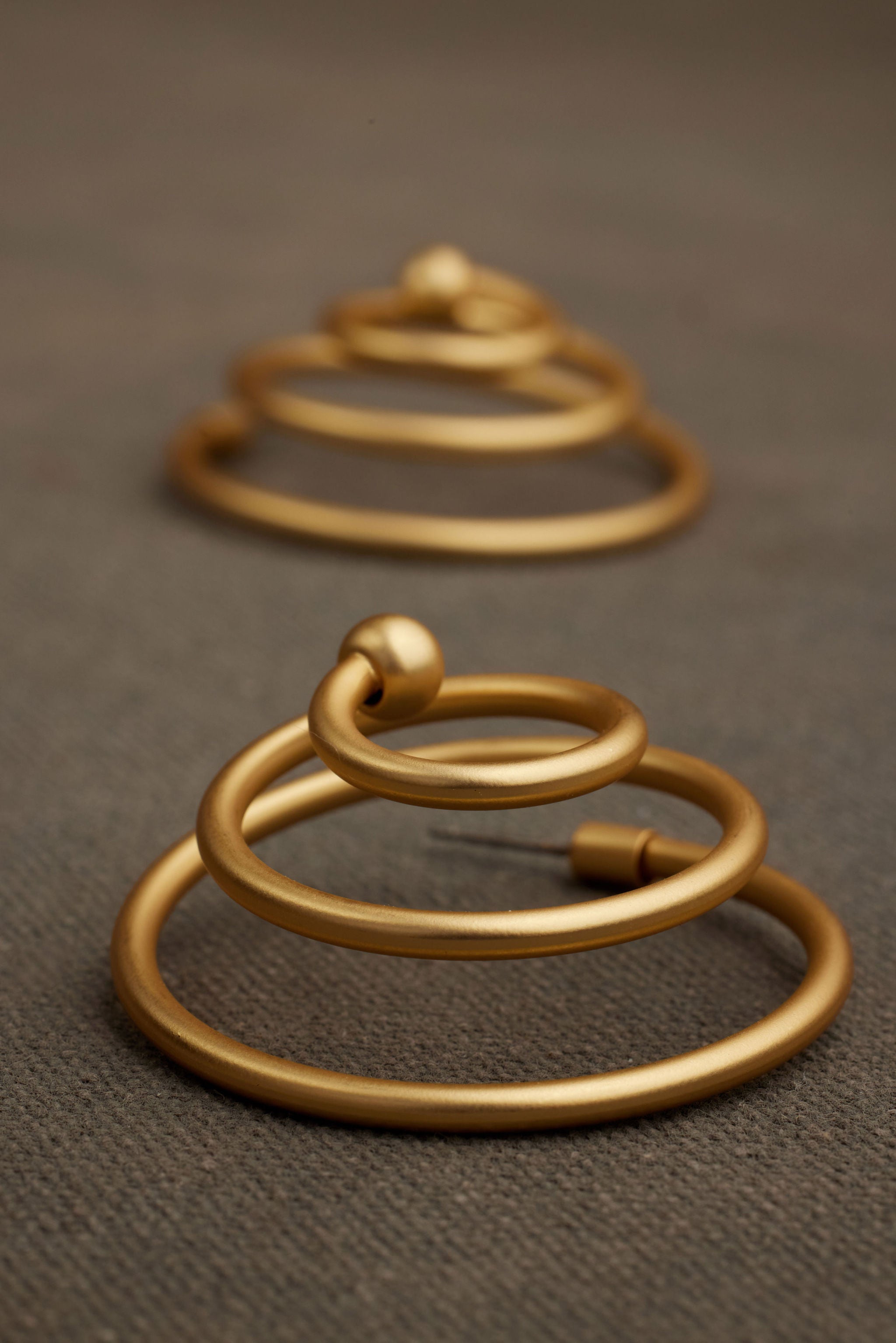 ZORA gold spiral earring side view